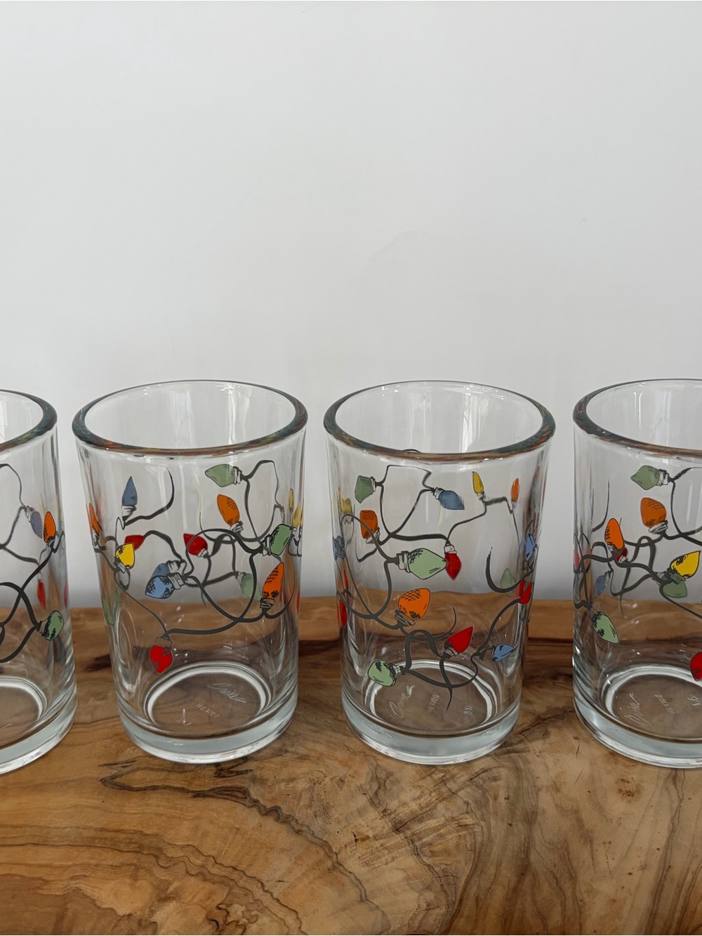 Pottery Barn - Set of 4 Colorful “Christmas String Lights” Juice Glasses.